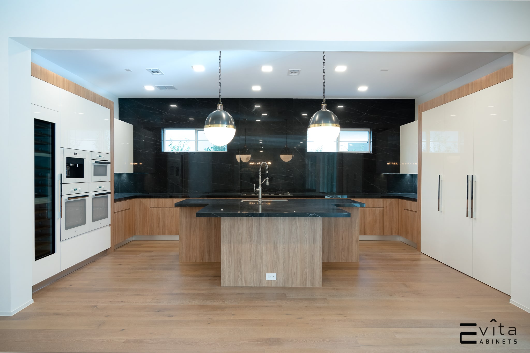 Modern Mocha-Toned Custom Kitchen with Black Marble Countertop