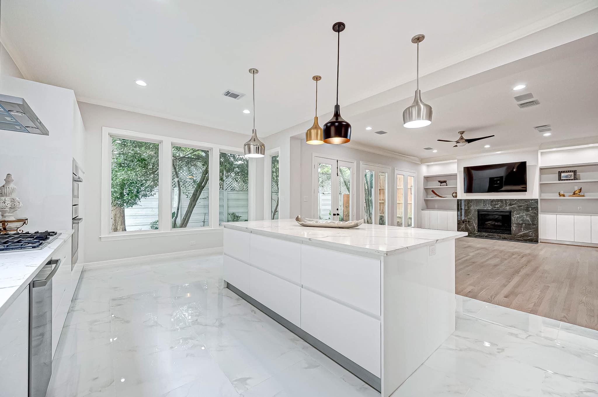 Sophisticated White Kitchen with Gray Marble Detailing
