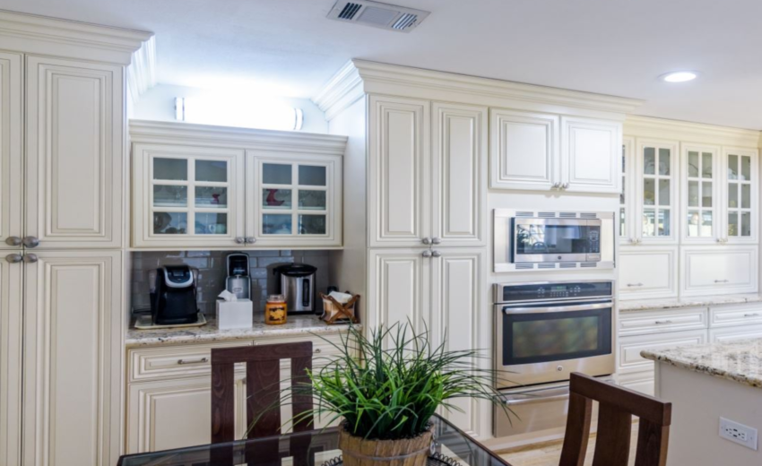 Classic Charm: White Kitchen And Marble Accents